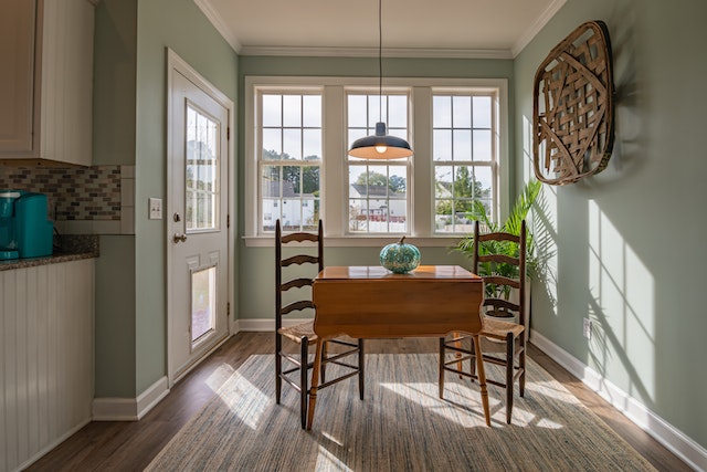 kitchen with large window and green pumpkin as centerpiece