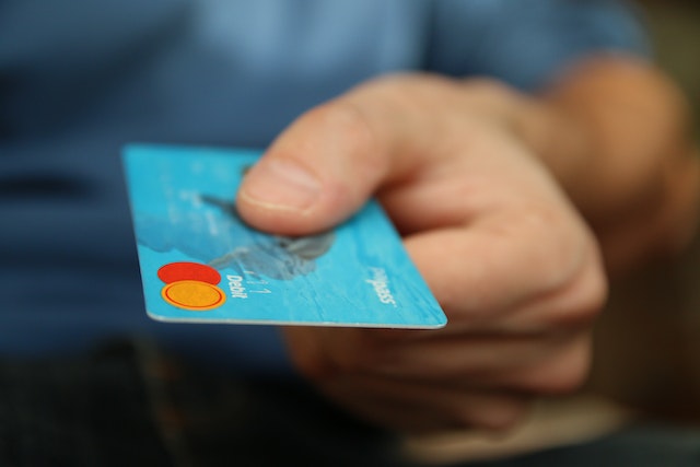 person using credit card